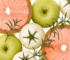 Sliced white tomatoes, green apples, and grapefruit